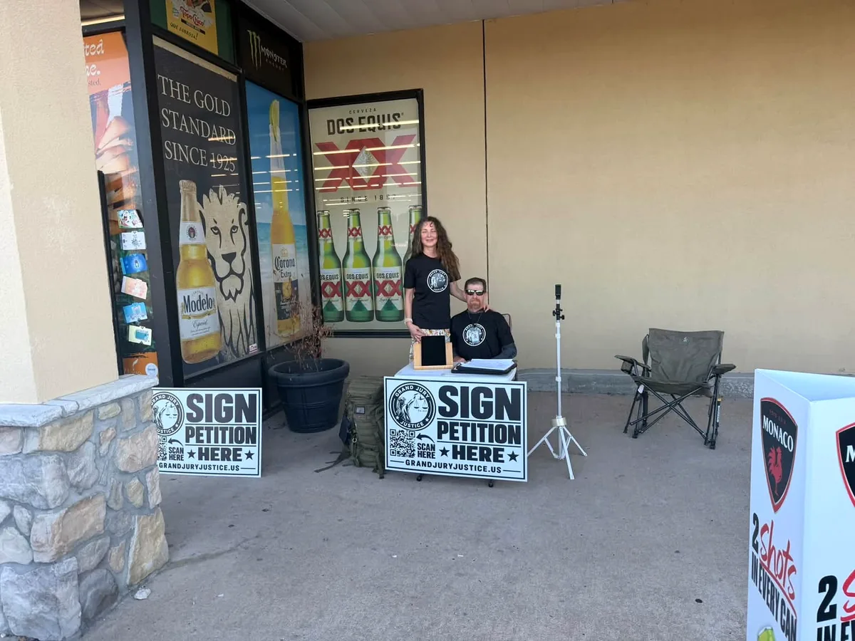 Grand Jury Justice petition signing table outside Booze Brothers in Broken Arrow.