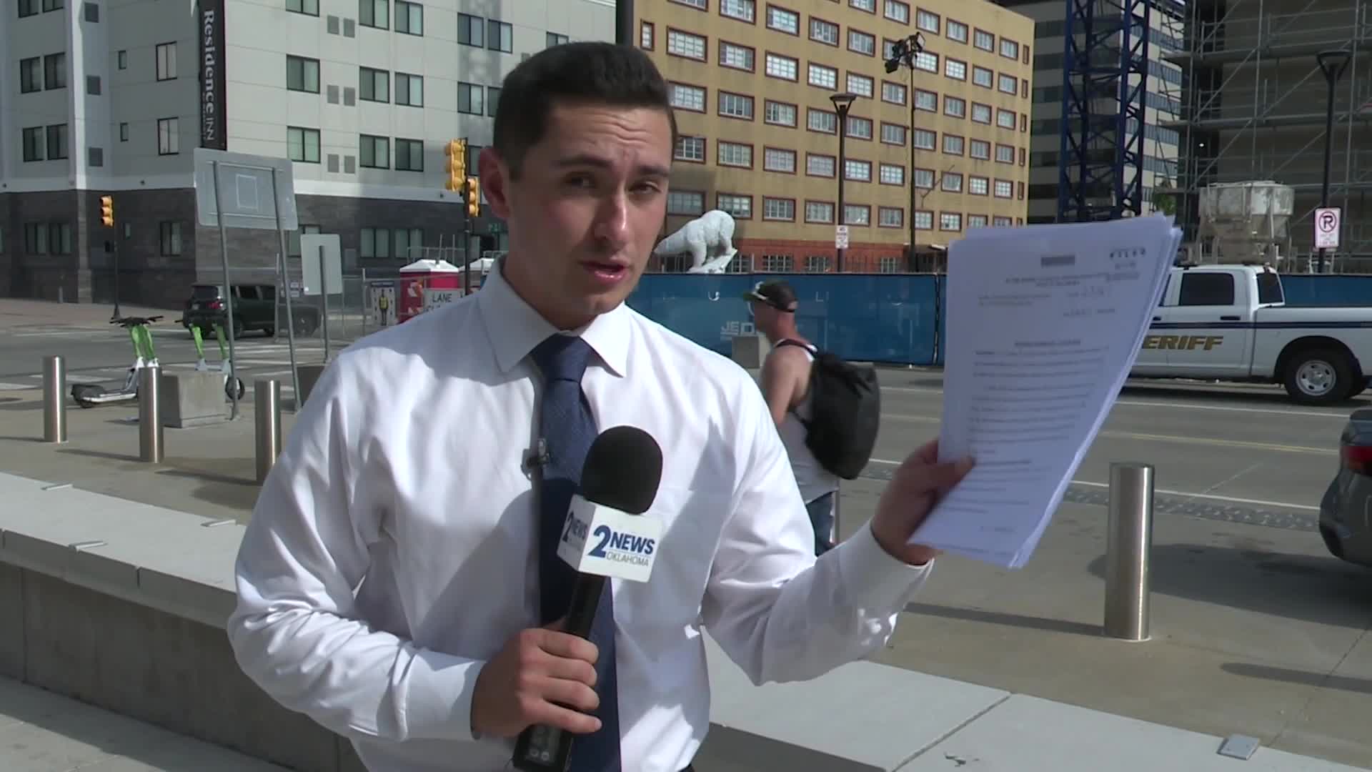 A 2 News reporter holds the petition outside the Tulsa County courthouse